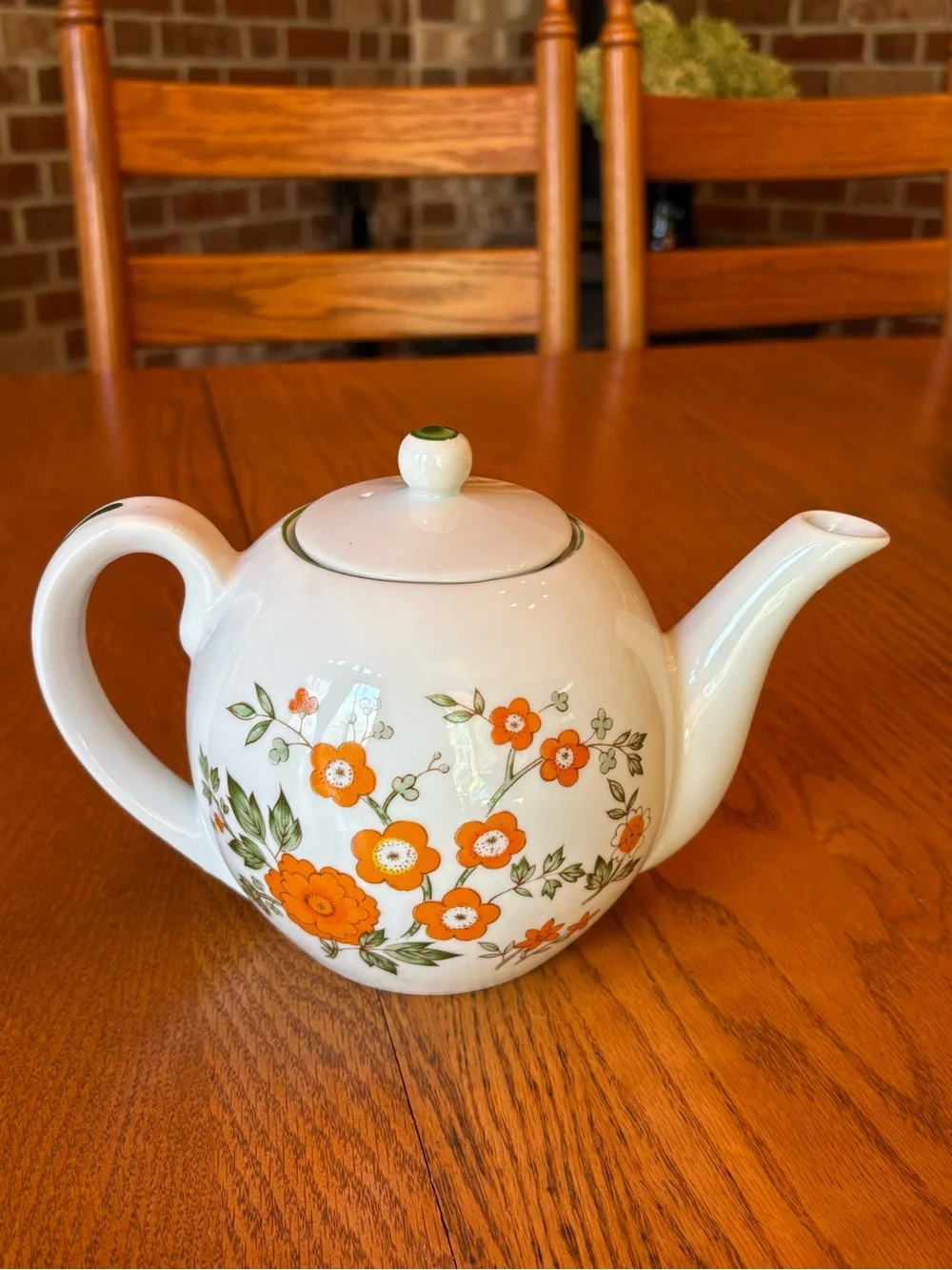 White Ceramic Teapot with Orange Floral Pattern